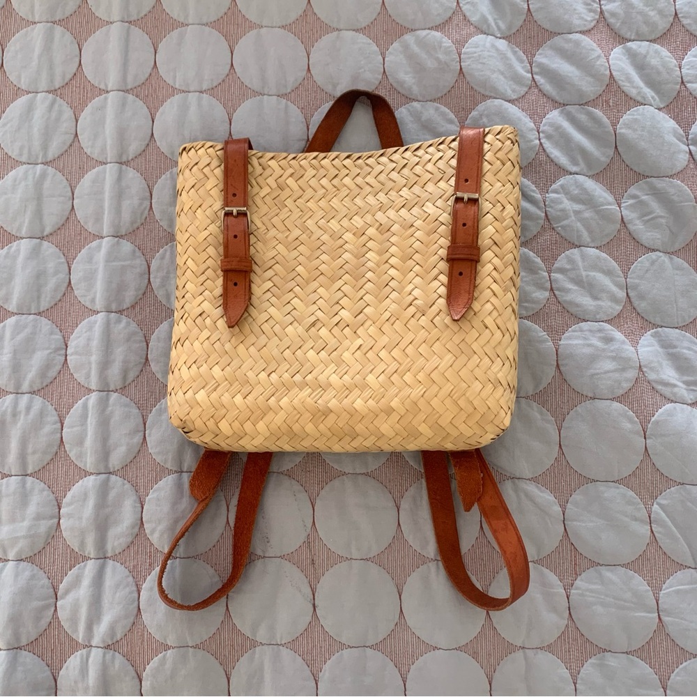 Hand woven straw backpack with leather straps